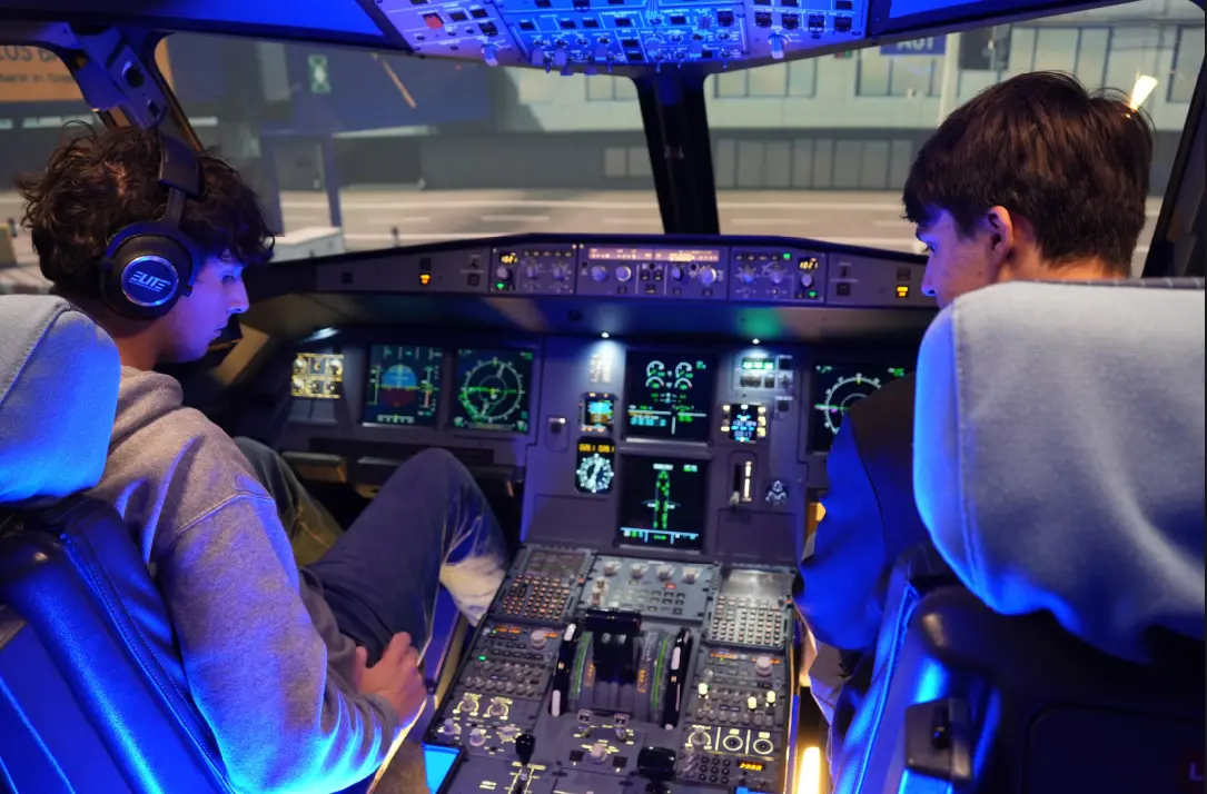 Happy couple in the cockpit after their flight experience